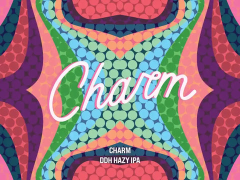 Colorful beer bottle with 'Charm' branding and 'DDH Hazy IPA' text on a vibrant patterned background.